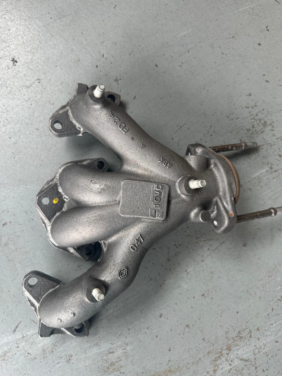 Exhaust manifold after Corrosion Assassin — clean iron